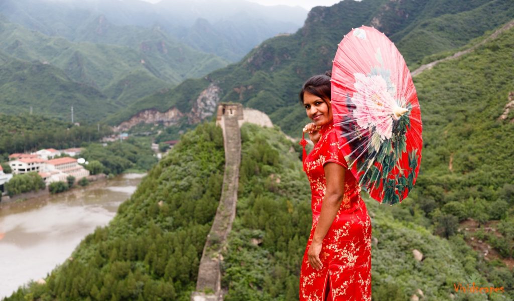 Traditional chinese attire and add a lovely umbrella to it